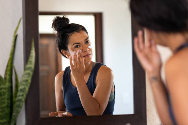 Woman Applying Sunscreen 